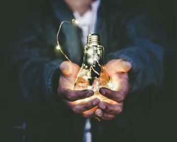 guy holding bulb