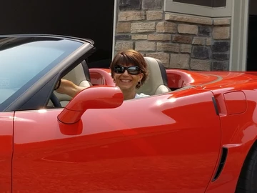 woman in red car